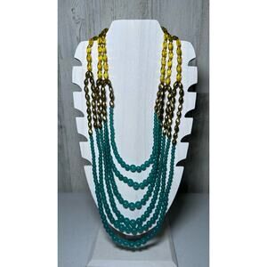 Collier pendentif Avon Gold Tone avec chaînes à trois couches silver et